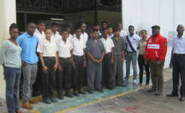 Students at the Leonora Technical and Vocational Training Centre in company of the Commander Stephen Mansell (second from right) and lecturers.