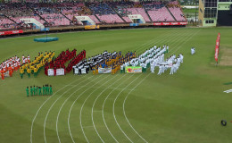 The 16 competing districts assembling to witness the feature address of the 55th National Schools Cycling, Swimming and Track and Field Championships yesterday at the National Stadium.
