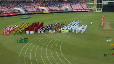 The 16 competing districts assembling to witness the feature address of the 55th National Schools Cycling, Swimming and Track and Field Championships yesterday at the National Stadium. 