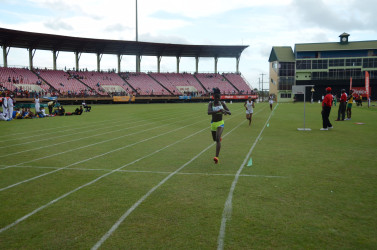 North Georgetown athlete, Claudrice McKoy stops the clock in a brisk 11 minutes and 24.9 seconds after fending off a brief challenge from Margaret Augusto (11m:27.6s) of District 9 to win the under-16 girls 3000m gold yesterday at the National Stadium  