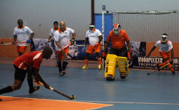 Old Fort’s Aderemi Simon (centre) in the process of attempting a penalty corner strike while GCC try desperately to thwart his effort during their team’s matchup in the Diamond Mineral Water Hockey Festival at the National Gymnasium 