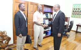 GFF 1st Vice President, Brigadier (rtd.) Bruce Lovell (centre) meets Minister of State Joseph Harmon (right) in the presence of President of the GFF Wayne Forde (Photo courtesy of the Ministry of the Presidency)
 
 