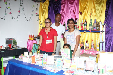 Christine Forrester and her family pose with their products at the Everything Makes Craft booth at Business Expo.