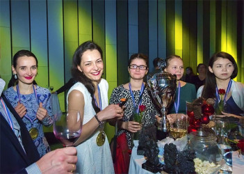 The jubilant Russian women’s chess team upon receipt of their trophy and gold medals at the 2015 European Team Chess Championships. The team dominated the Championships through and through scoring eight match wins and one draw in the nine rounds.