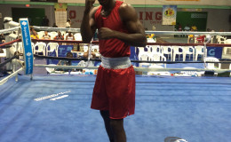 Guyana's captain, middleweight, Dennis Thomas strikes a pose after his round 2 TKO win versus Bahamian, Hubert Fernandes.