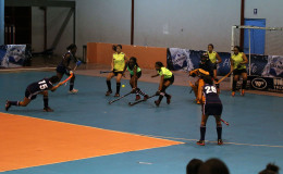 Sonia Jardine (centre) of Pizza Hut GCC in the process of scoring a penalty corner during her side’s crushing win over Hikers in the Diamond Mineral Water Hockey Festival at the National Gymnasium.
 
