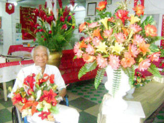 Compton Young In 2010 surrounded by his floral creations 