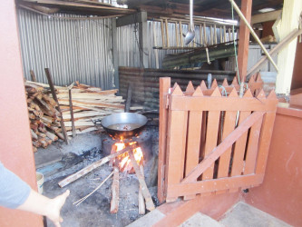 The Fire side utilized by Mohanlall Kissoon to cook his dogfood. His neighbour Narissa Deokarran contends that the smoke from the burning of the wood daily aggravates her allergies, thereby crippling her with respiratory problems.  