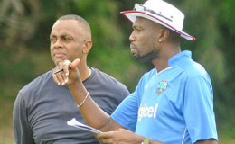 Courtney Walsh (left) chats with former pace partner Curtly Ambrose during a recent West Indies training session in Brisbane. Ambrose is a bowling consultant to the team. (Photo courtesy WICB Media)
