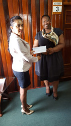 Mohini Somaroo (left) Company Secretary/ Corporate Manager of GNSC Ltd presenting the cheque to Deputy Town Clerk S Jerrick.