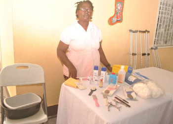 Jackie Williams with foot care items. (Ptolemy Reid Rehabilitation Centre photo) 