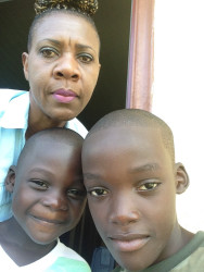 Keith Adams with his older brother Tyrese and would-be adoptive mother, Nan Piggott, in happier times.