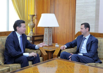 The World Chess Federation President Kirsan Ilyumzhinov is shown here (at left) in dialogue with Syrian President Bashar al-Assad in April 2012 in Damascus. President Assad had tasked the Syrian Ministry of Education to join the “Chess in Schools” project administered by FIDE. According to Ilyumzhinov, “The Syrian President plays chess very well—since his studies in London.” Two weeks ago, the US government blacklisted the FIDE president for materially assisting the Syrian government. Recently, President of the Russian Chess Federation Andrey Filatov proposed that Ilyumzhinov run for the FIFA presidency.