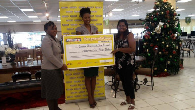 Commercial Manager of Courts, Main Street, Tracy Smith (centre) handing over the cheques to the two winners, Carolyn Brandon (left) and Olive Kirpaul 