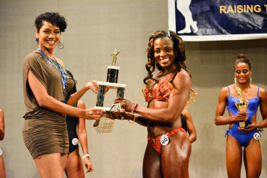 Alisha Fortune collecting her Ms. Best Legs award.  