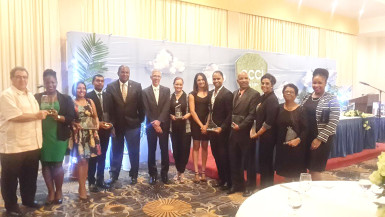 In photo, the winners along with Minister of Business Dominic Gaskin (8th from right) and President of GCCI Lance Hinds (9th from right). 