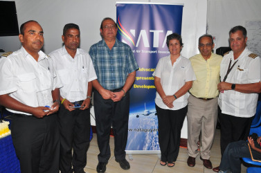 Recipients Captain Gary Sahai (left), Supervisor of Operations Bholanauth Baijnath (second, left) and Director of Aviation Safety Regulations Ankar Doobay pose with NATA President Annette Arjoon-Martins (third, right), Vice President, Captain Gerry Gouveia (right) and Vice Chairman of the Private Sector Commission Edward Boyer (second, right).