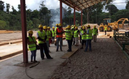 North Rupununi community leaders paying close attention as the sawmill manager explains the operations. (Photo courtesy of Iwokrama)
