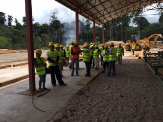 North Rupununi community leaders paying close attention as the sawmill manager explains the operations. (Photo courtesy of Iwokrama)
