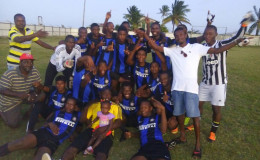 The victorious Uitvlugt Warriors team following the conclusion of the match against Pouderoyen FC