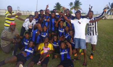 The victorious Uitvlugt Warriors team following the conclusion of the match against Pouderoyen FC