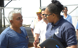 Minister Annette Ferguson (right) speaking to a resident. (Ministry of Public Infrastructure photo)