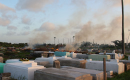Debris being burned in Le Repentir Cemetery. (Photo by Keno George)