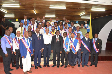 President David Granger  (seventh from right in front row) flanked by some of the men honoured by the National Association of Adventist Men’s Ministry for their longstanding service and dedication.  (Ministry of the Presidency photo) 