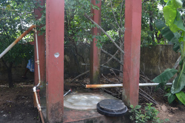 At the back of Paul Morrison’s yard where the tank with a gunshot can be seen on the post. 