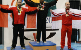 Karel Mars is draped with the Golden Arrowhead atop the podium after lifting a total of 817kgs, good enough for the Commonwealth gold in the 105kg Men’s Open Class.
