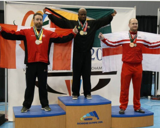 Karel Mars is draped with the Golden Arrowhead atop the podium after lifting a total of 817kgs, good enough for the Commonwealth gold in the 105kg Men’s Open Class.