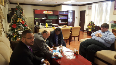 Minister of Public Security, Khemraj Ramjattan (second from right) and US Ambassador Perry Holloway signing the MoU yesterday. Also in photo at right is Deputy US Head of Mission, Bryan Hunt (right) and CANU Head James Singh. 