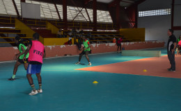 GFF Technical Director Claude Bolton (right) in the process of supervising a part of the session during the opening day of trials to short-list the Futsal squad 