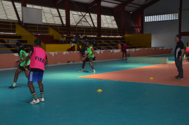 GFF Technical Director Claude Bolton (right) in the process of supervising a part of the session during the opening day of trials to short-list the Futsal squad   