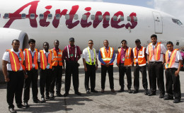 Students and lecturers of the new Air Services Limited Aeronautical Engineering School and instructors from Caribbean Airlines on the CJIA tarmac, at Timehri yesterday. ASL Marketing Manager Annette Arjoon-Martins is fourth from the right. (Photo courtesy of ASL) 