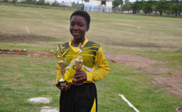 St Stephen’s’ Odelli Straughn displaying her MVP and Best Goal-Keeper accolades following her team’s win over Stella Maris