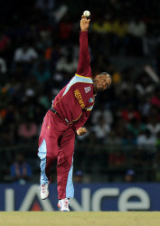 Part-time off-spinner Marlon Samuels has been banned from bowling in international cricket