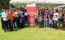 First Lady, Sandra Granger and other officials pose with the students (Ministry of the Presidency photo)