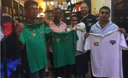 Representatives of Branderz Guyana, displaying the apparel supplied to the power lifting team prior to their medal heist in Canada. Also pictured in photo is Managing Director of the company, Martin Brock. 
