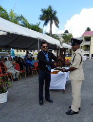 Mitra Ramkumar (left), Roraima’s Chief Finance Officer officially presented the prizes of a return ticket to New York compliments of Dynamic International Airways, a day tour for two to Arrowpoint Nature Resort and a Dinner for two at Duke Restaurant, to DSP Bacchus.