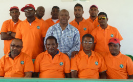 Moleson Creek bus drivers pose in their new uniforms with Director General of the Ministry of Tourism Donald Sinclair