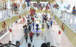 Come on in! Christmas Shoppers making their way into the Giftland Mall,
Turkeyen East Coast Demerara. 