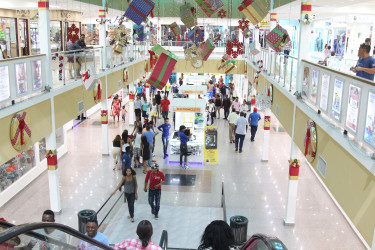 Come on in! Christmas Shoppers making their way into the Giftland Mall,
Turkeyen East Coast Demerara. 