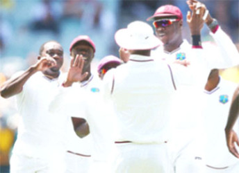  West Indies celebrate the wicket of David Warner early on the opening day of the second Test against Australia at the MCG. (Photo courtesy WICB Media)  