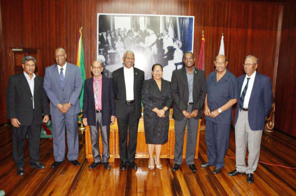 President David Granger (fourth from left) is flanked by, from left Commissioner Badrie Persaud; Minister of State, Joseph Harmon; new commissioners Rajendra Bissessar and Dela Atta Kuma Britton; Minister of Public Infrastructure, David Patterson; Chairman of the PUC, Retired Justice Prem Persaud; and  Commissioner Maurice Solomon.     