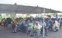 The crowd waiting in anticipation for a chance to speak to Minister of State Joseph Harmon  or one of the officers.