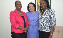 First Lady Sandra Granger (centre) shares a warm moment with (from left) Sheila Roseau, Director and Representative of the United Nations Population Fund and Ms. Patrice La Fleur, Assistant Representative of the UNFPA (GINA photo)