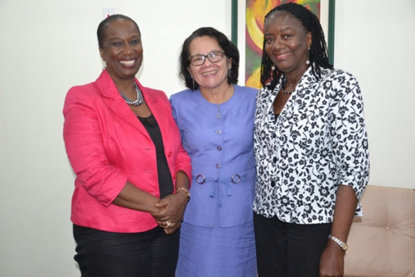 First Lady Sandra Granger (centre) shares a warm moment with (from left) Sheila Roseau, Director and Representative of the United Nations Population Fund and Ms. Patrice La Fleur, Assistant Representative of the UNFPA (GINA photo)