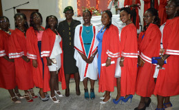 Minister within the Ministry of Education, Nicolette Henry (sixth from left) with some of the graduates. (Department of Culture, Youth and Sport photo)