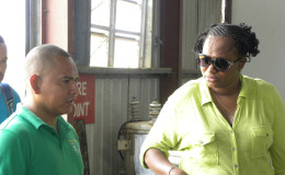 Minister Annette Ferguson in discussion with Kaituma Power and Light Company (KPL) CEO, Shawn James (Ministry of Public Infrastructure photo)